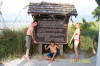 Breanna, Mason and Shane in front of Sign